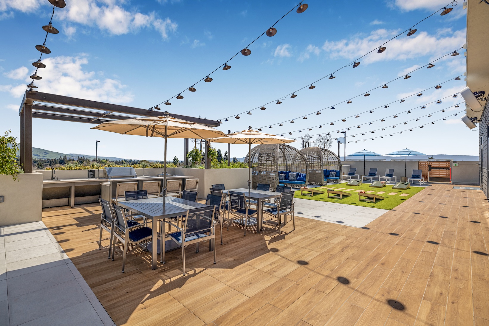 Access to resident-only features a rooftop grilling area with umbrellas