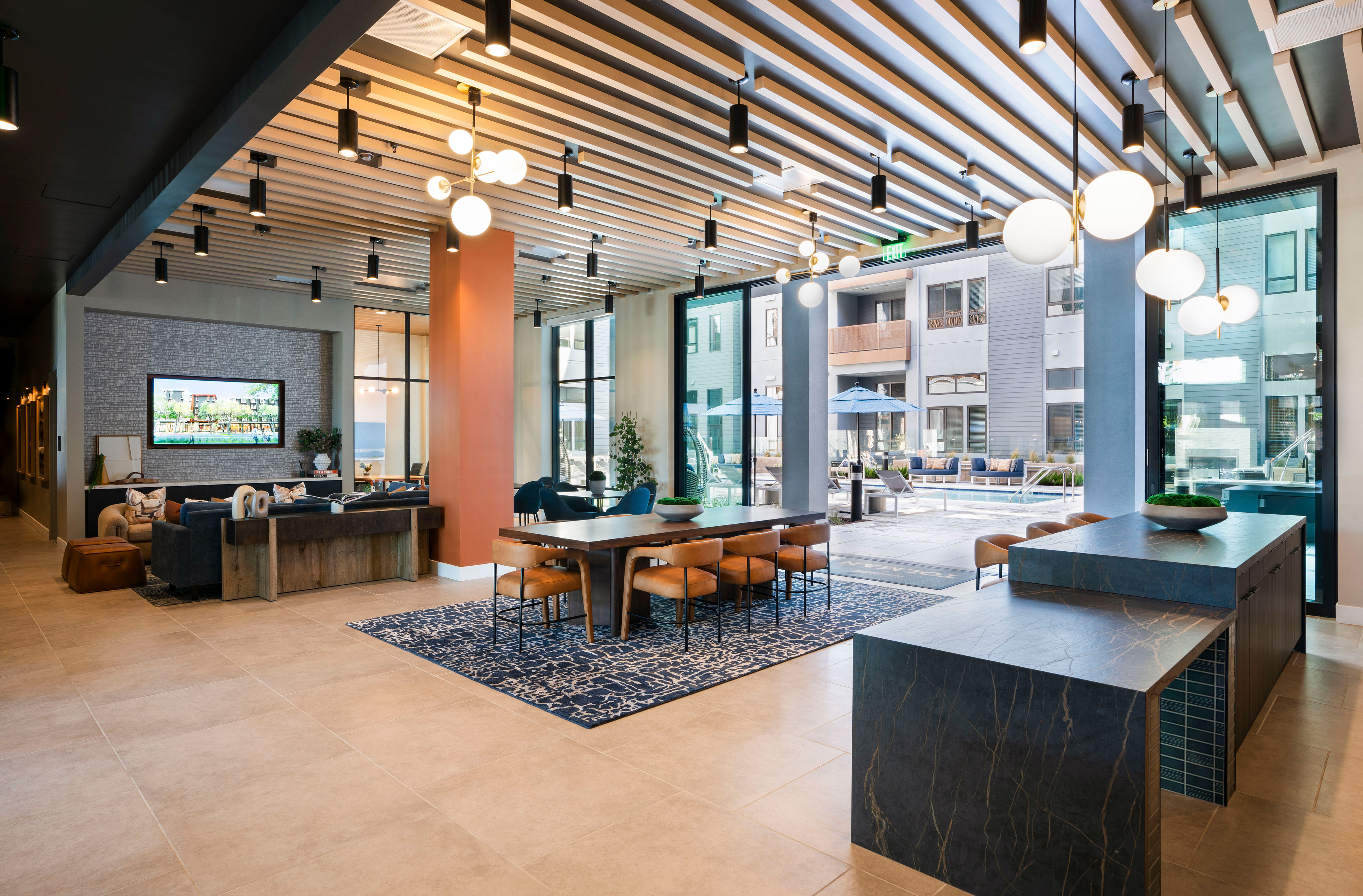A modern, well-lit lounge area for residents and prospective applicants at The Tolman luxury apartments in Fremont, CA.