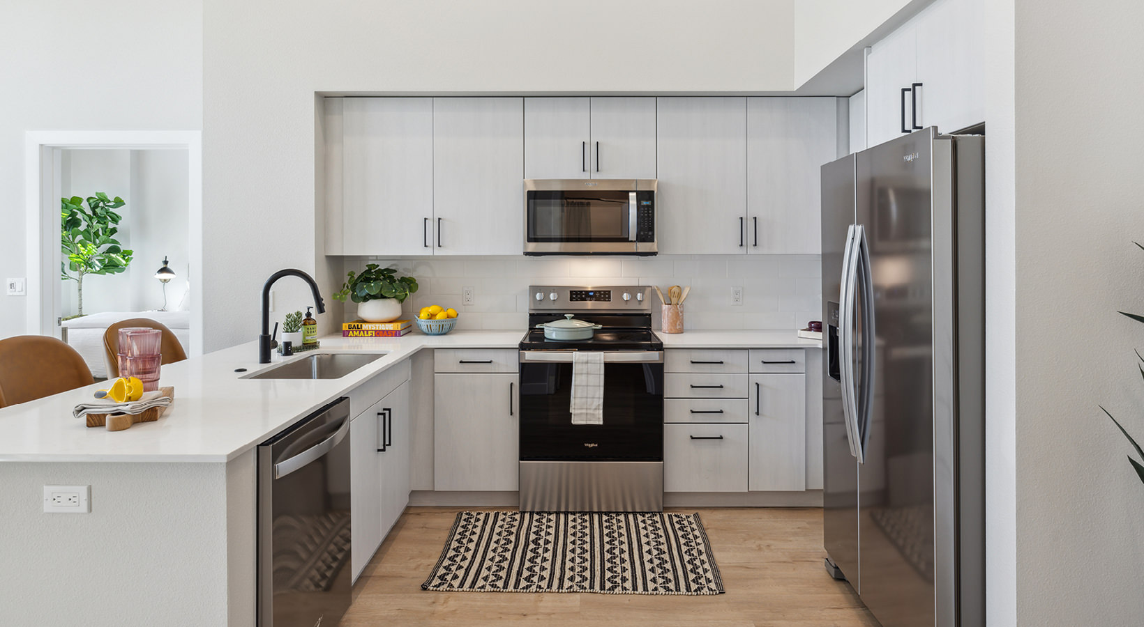 a kitchen with white cabinets