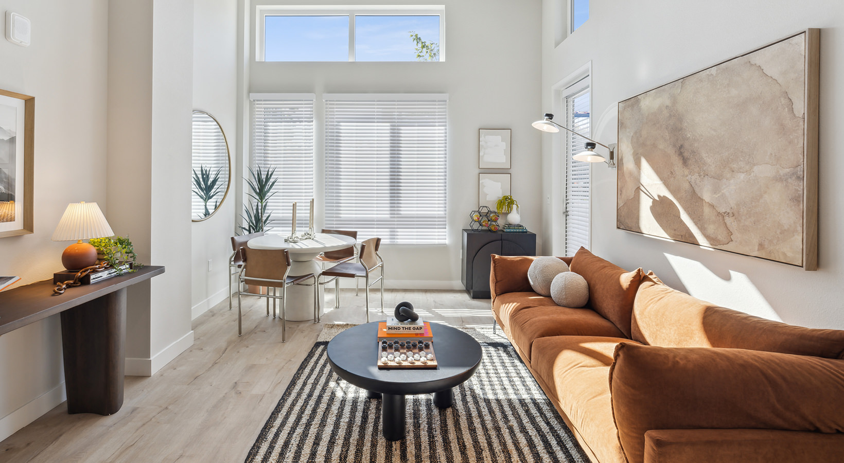 a living room with a couch and a table