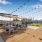 a rooftop grilling area with umbrellas