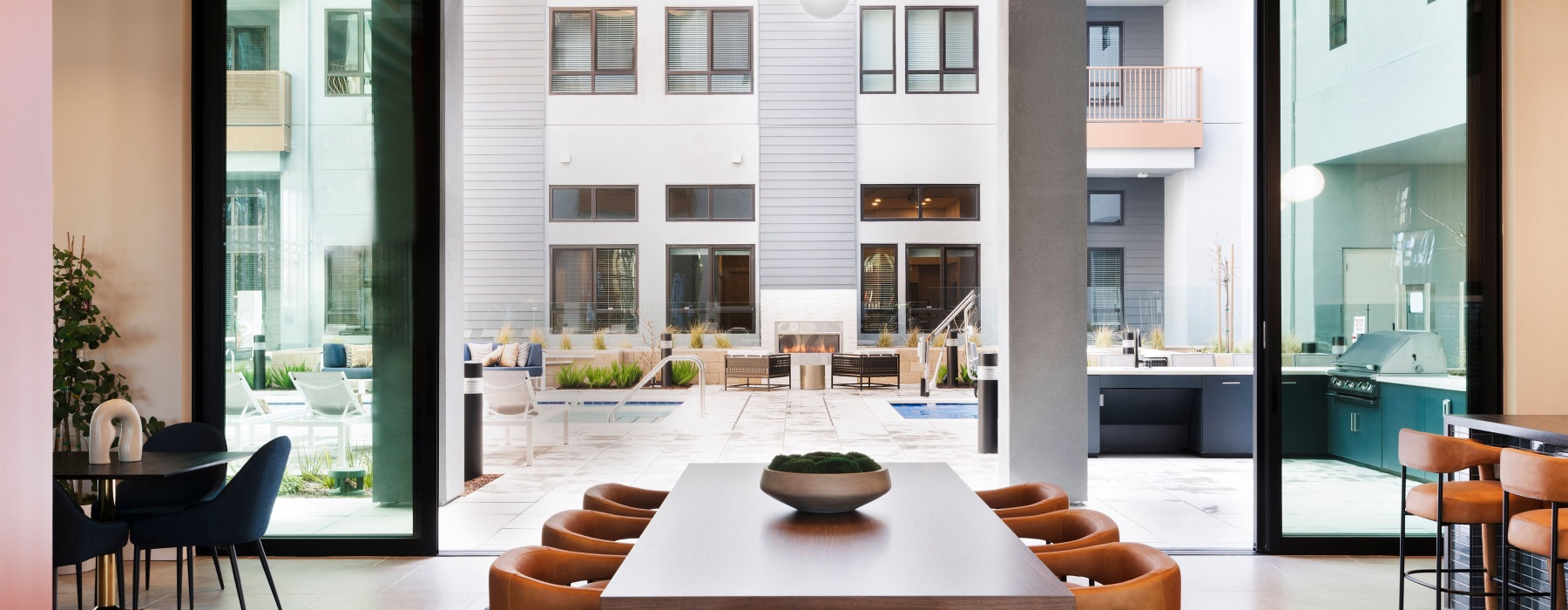 a room with a glass wall with a railing