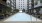 a swimming pool in a courtyard between buildings