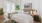a bedroom with a large painting on the wall