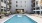 Resort-style swimming pool with lounge seating