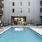 Resort-style swimming pool with lounge seating