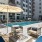 Resort-style swimming pool with lounge seating